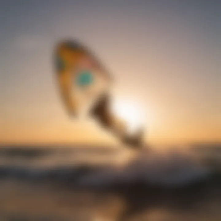 Silhouette of a kitesurfer at sunset, showcasing the beauty of using the Ozone Trainer Kite