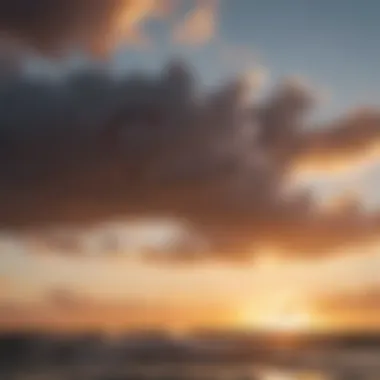 Silhouette of a kitesurfer at sunset with dramatic sky