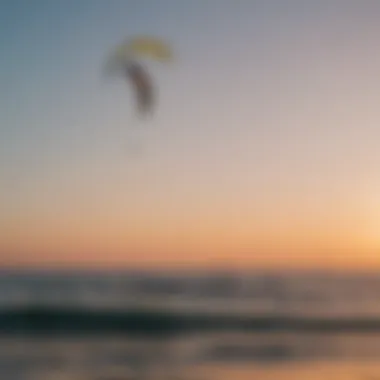 Silhouette of kitesurfers against a vibrant horizon