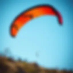 High-performance Slingshot RPM kite soaring against a blue sky