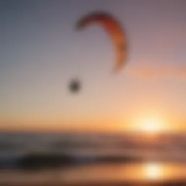 Silhouette of a kitesurfer catching the wind at sunset