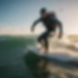 Rider carving through waves on a starboard