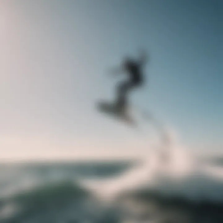 Silhouette of a kitesurfer performing a stylish duotone jump