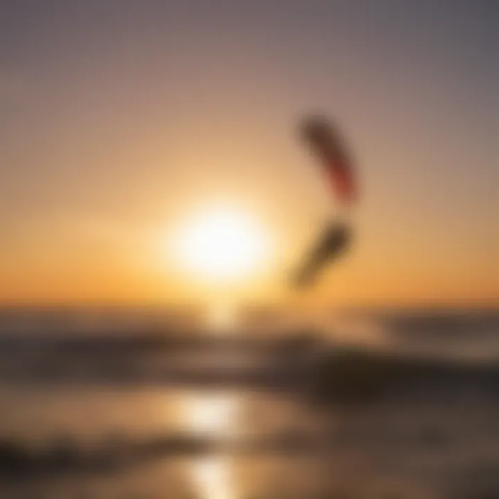 Silhouette of a kitesurfer against a vibrant sunset with the Duotone 12m Kite