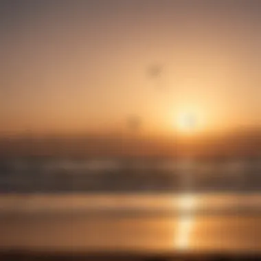 Sunset silhouette of kitesurfers gliding gracefully on the ocean