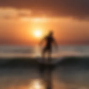 Sunset silhouette of water foil surfer against the horizon