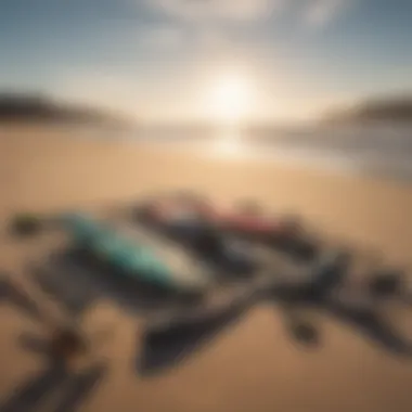 Kitesurfing equipment laid out on the sandy beach