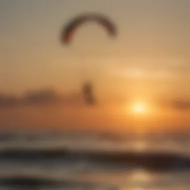 Kite surfer performing tricks with the sun setting in the background in Outer Banks