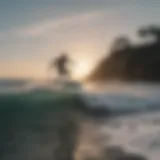 Surfer catching a wave at La Pointe Surf Camp