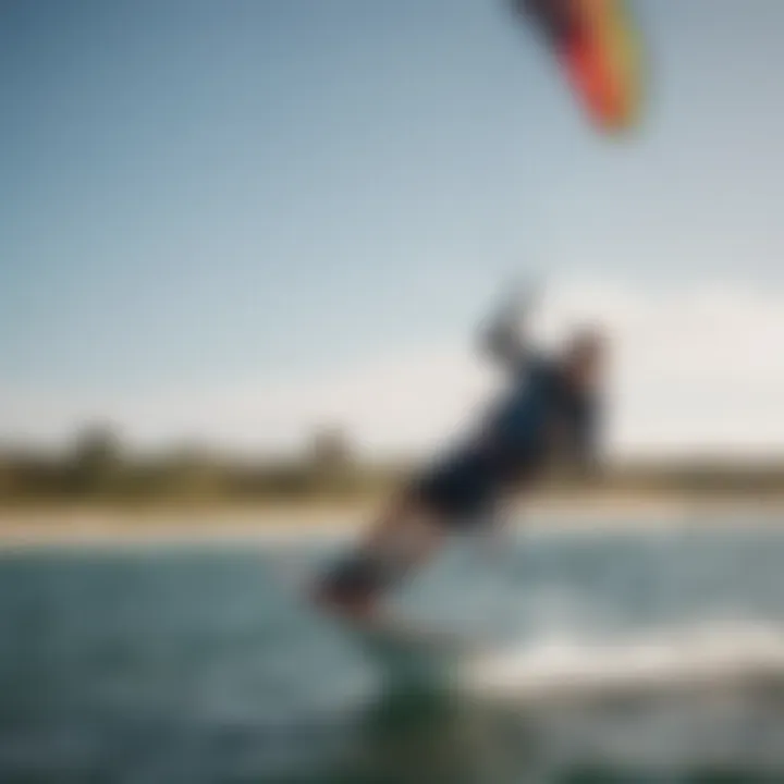 A kitesurfing enthusiast skillfully maneuvering a small kite over water.