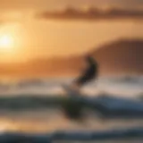 Kitesurfer riding the waves against the backdrop of a stunning Greek sunset