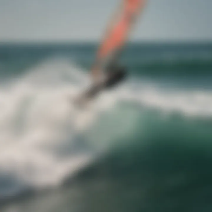 Aerial view of kitesurfer elegantly backrolling over the waves