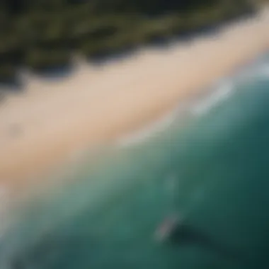 An aerial view of a serene beach where efoiling is taking place