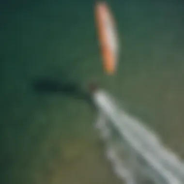 An aerial view of kitesurfers on water, demonstrating the harmony between nature and sport.