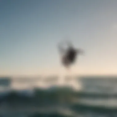 A kitesurfer in action, utilizing the Slingshot foil mast for an enhanced riding experience