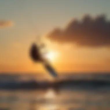 Kiteboarder performing tricks with the sun setting in the background