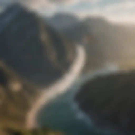 Aerial view of kiteboarder catching airtime with mountains in background