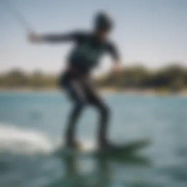 Wakeboarding academy instructor demonstrating proper stance and balance on the board