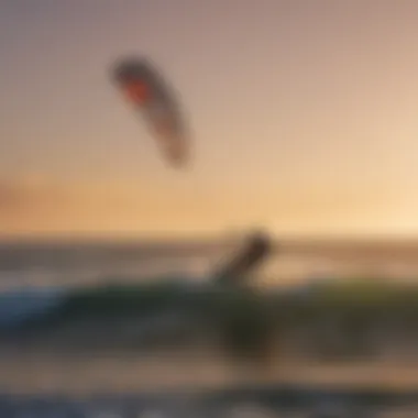 Kitesurfers riding the waves at sunset