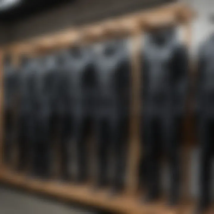 A selection of Yamamoto neoprene wetsuits displayed on a rack for comparison